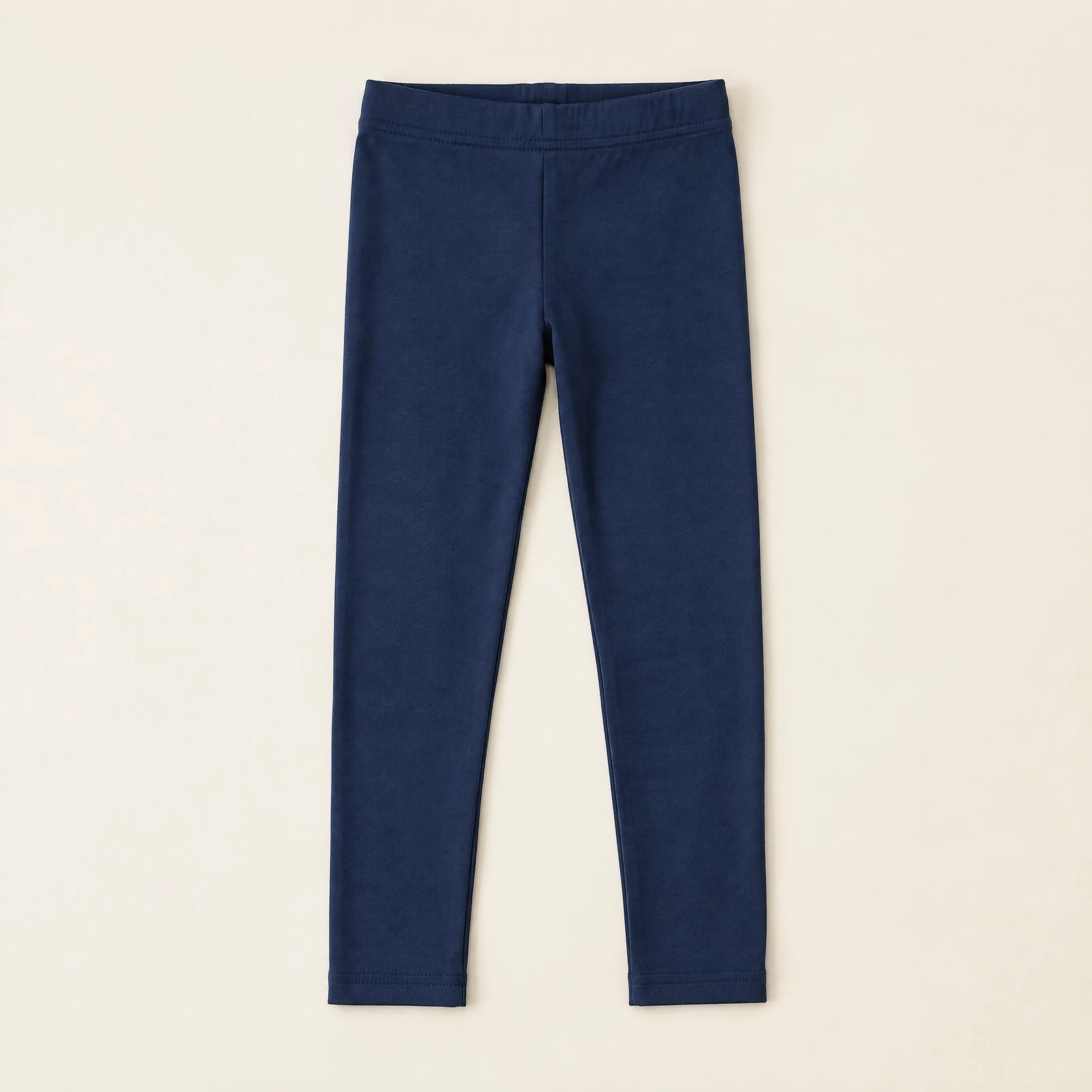 Navy blue kids' leggings laid flat